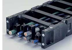 Strain relief cable clamps for use with energy chains