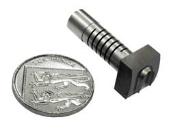 Helical flexure used in self-aligning, long-life die cutter