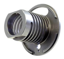 Extension and compression springs machined from solid material