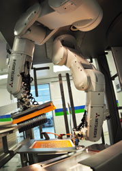 Coordinated syringe handling by Mitsubishi Electric robots