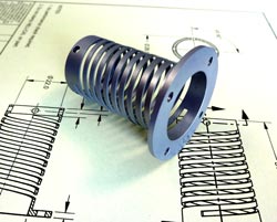Machined compression and extension spring replaces wire spring