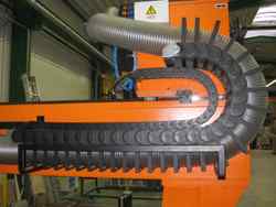 igus energy chain protects huge extraction hose