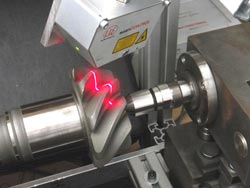 Laser line scanner inspects run-out of complex gears