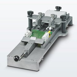 Jig speeds insertion of PCBs into electronic housings